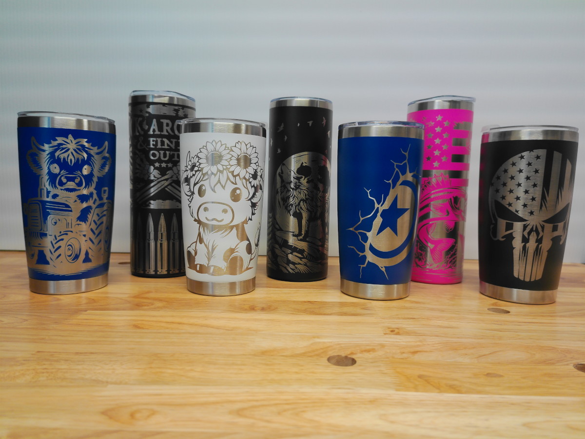 Custom laser engraved stainless steel tumblers with personalized designs and branding